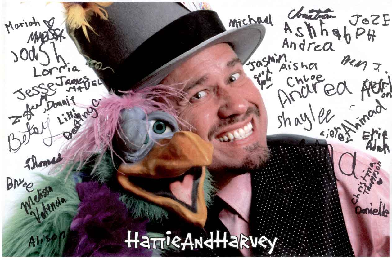Postr of Hattie and Harvey signed by audience members from a birthday party show.
